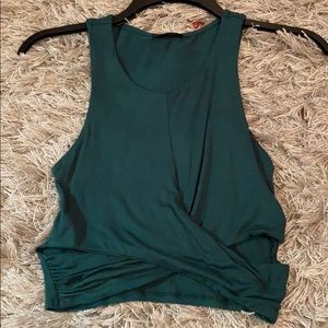 Green crop top with cut outs at bottom